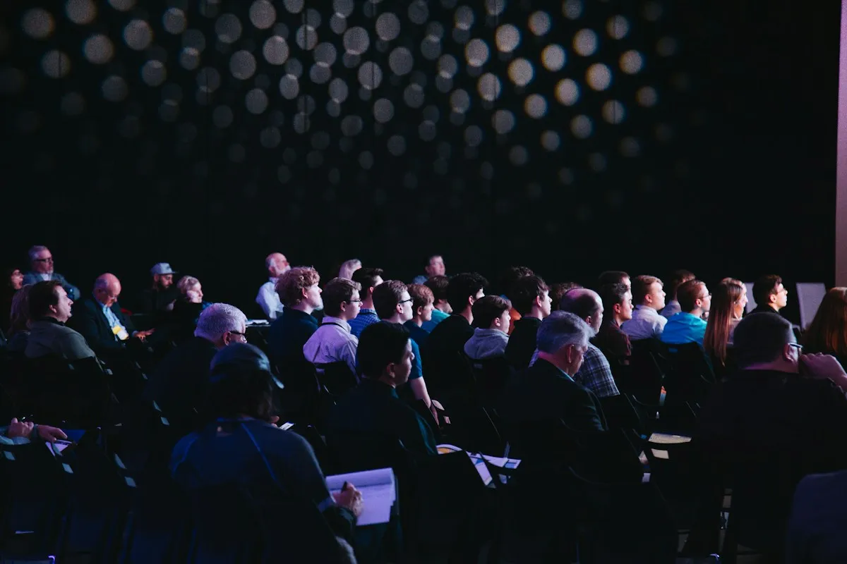 Audience seated in a conference hall