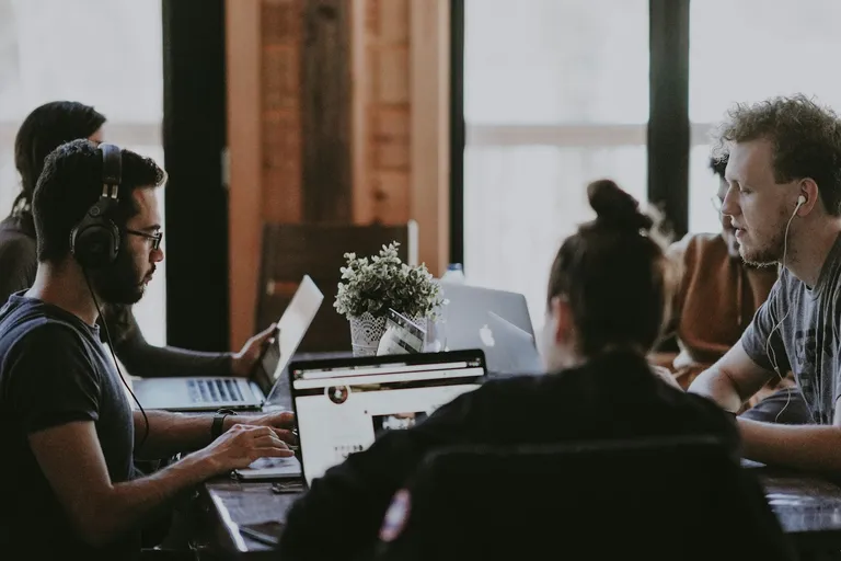 Colleagues meeting around a table