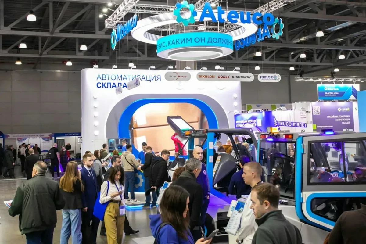 Crowd at an exhibition with booths and displays