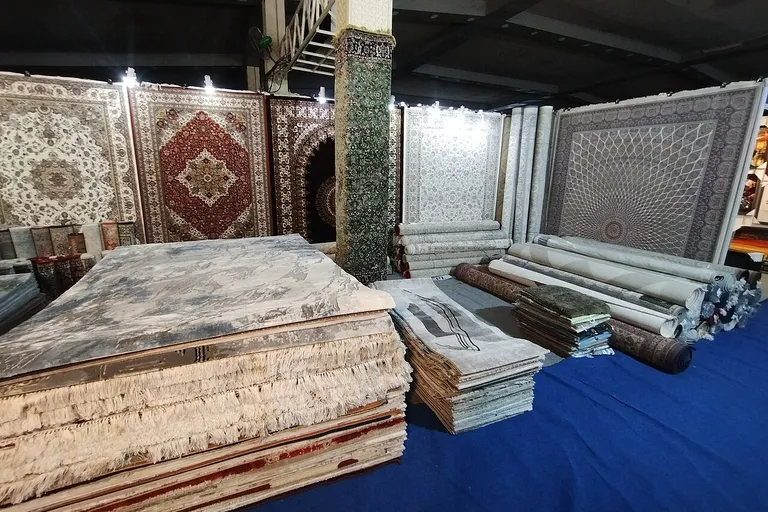 Furniture and carpets displayed at a furniture trade fair stand
