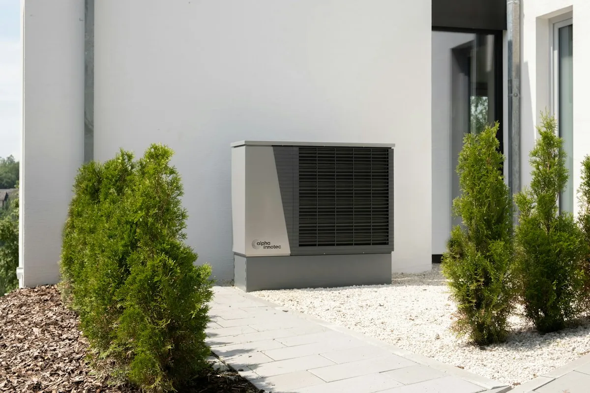 Heat pump unit on the side of a building
