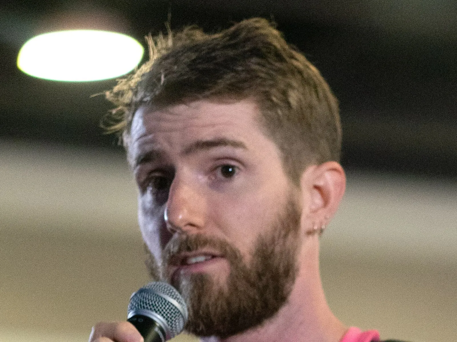 Linus Sebastian of Linus Tech Tips holding a microphone at LTX 2023