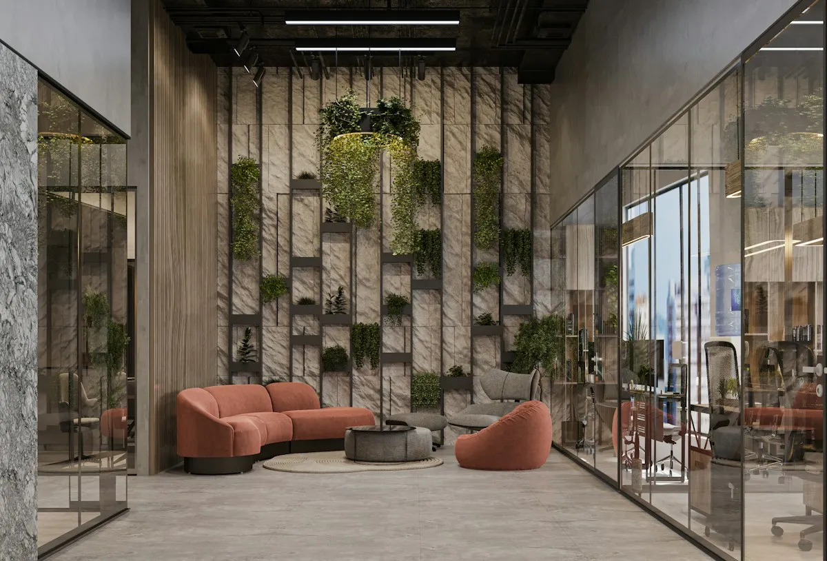 Office lounge with a couch, chair and mirrored walls