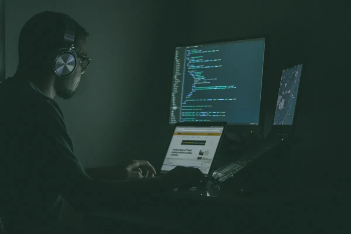 Person working on laptop computers