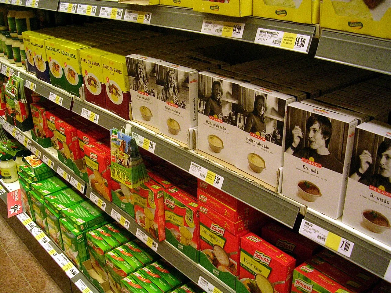 Private label and branded products on a supermarket shelf
