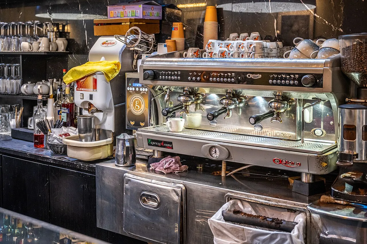 Professional espresso machine on a coffee bar counter, the kind of equipment shown at HOST