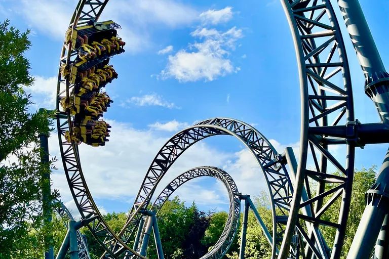 Roller coaster under a blue sky