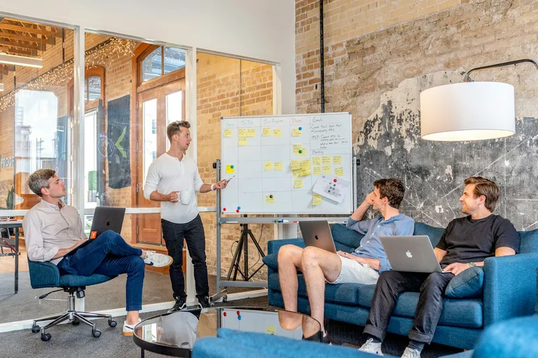 Sales team watching a whiteboard presentation