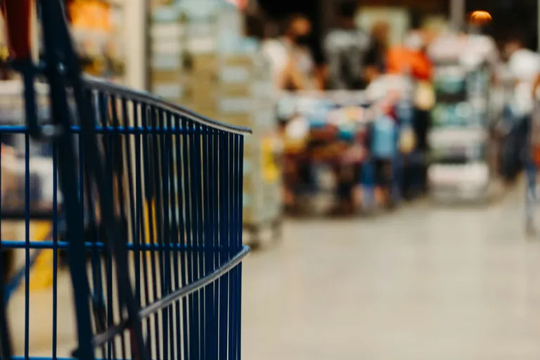 Shopping cart in a grocery store aisle