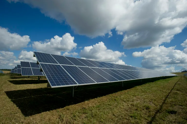 Solar panels on a green field