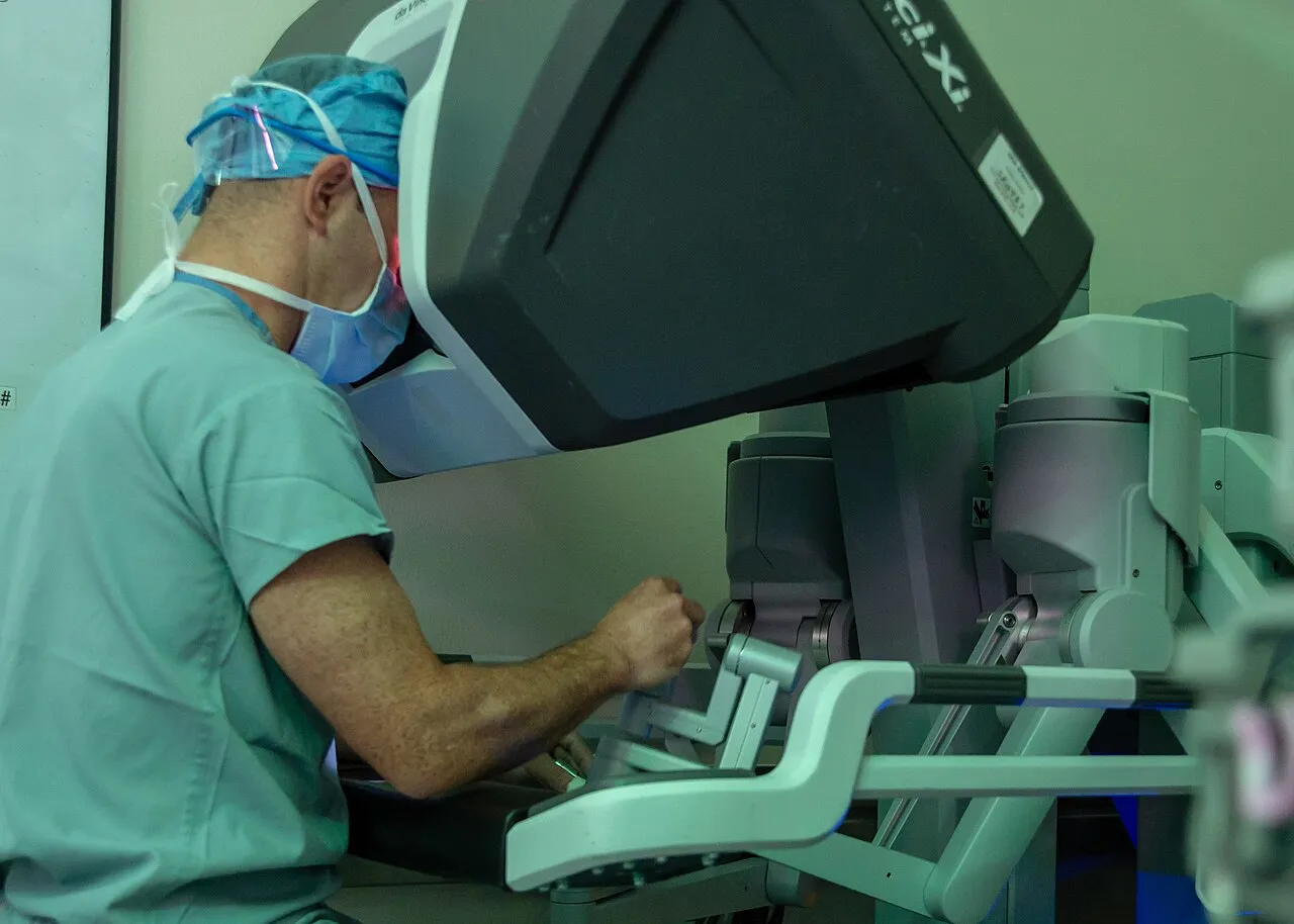 Surgeon performing robot-assisted urologic surgery