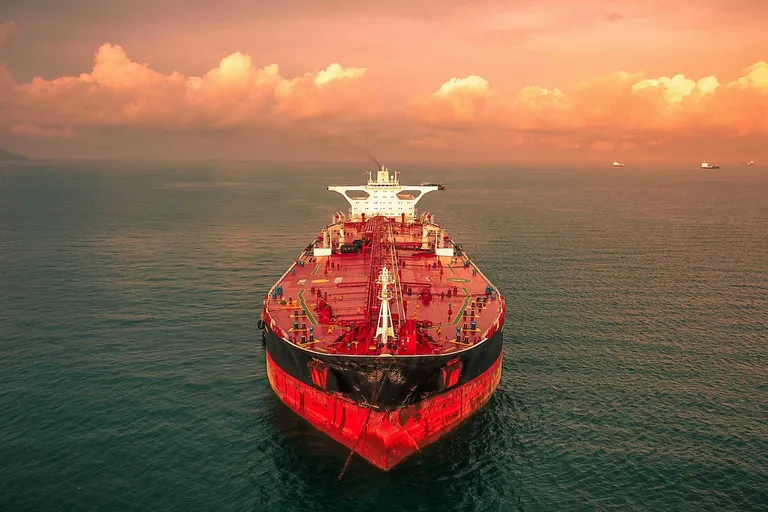 Tanker ship at sea under a cloudy sky