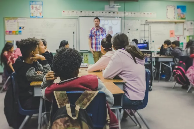 Teacher presenting to students in a classroom