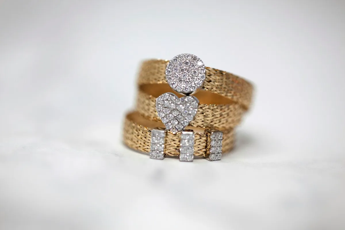 Three gold studded rings