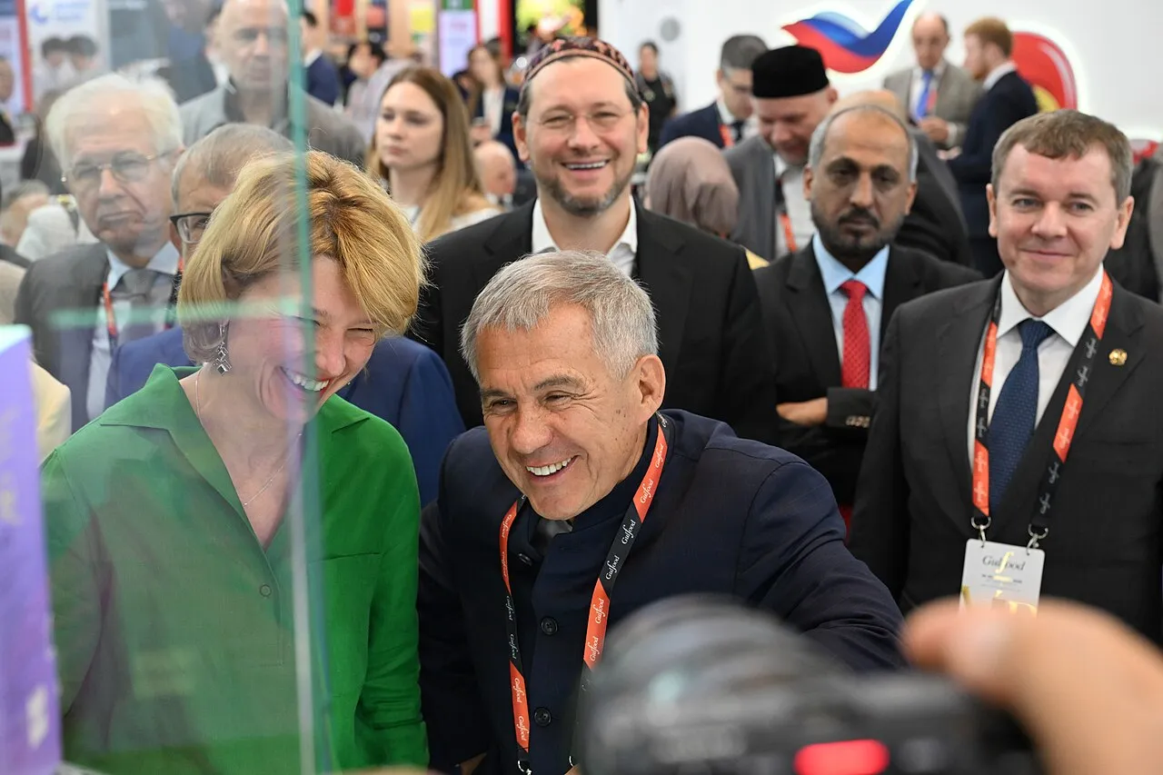 Visitors at a food trade fair pavilion