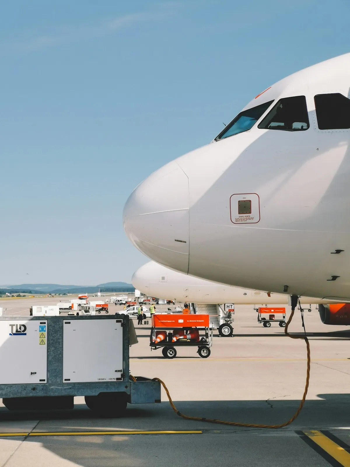 White airplane under a clear blue sky