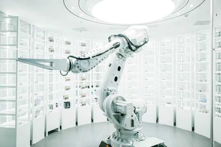 White robotic arm in a display showroom