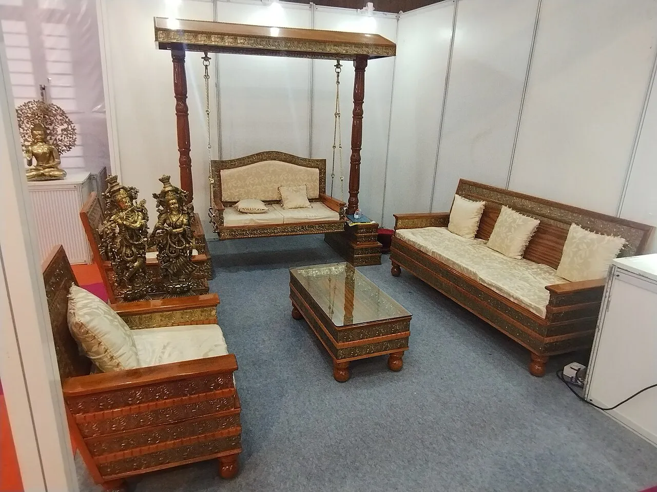 Wooden home furniture on display at a furniture trade fair stand